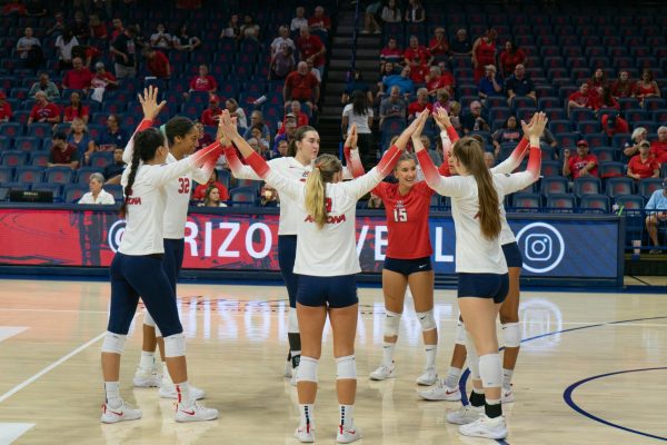 The starters for the Arizona volleyball team hype each other up before their game against Long Beach State on Thursday, Sept. 14, in McKale Center. This game was part of the Wildcat Classic.