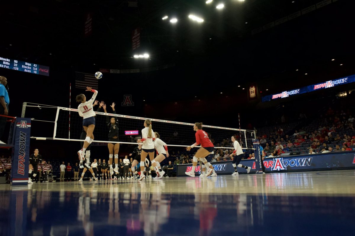 Jaeylin Hodge returns a volley in their game against Long Beach State on Thursday, Sept. 14, 2023 at McKale Center. This game was part of the Wildcat Classic.