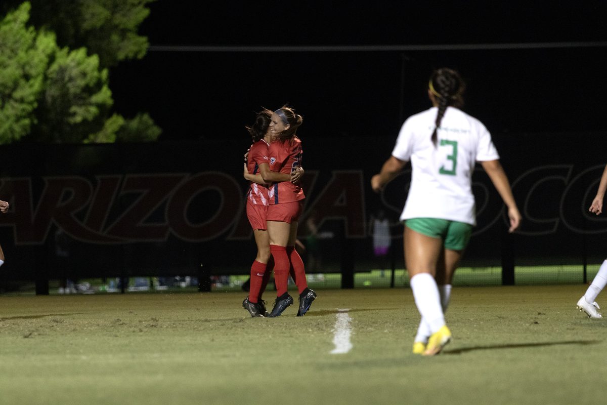 Arizona soccer teammates Sami Baytosh and Nicole Dallin celebrate the first goal during the game on Sept. 22 at Murphey Field. The Arizona soccer team won the game against Oregon 3-0.