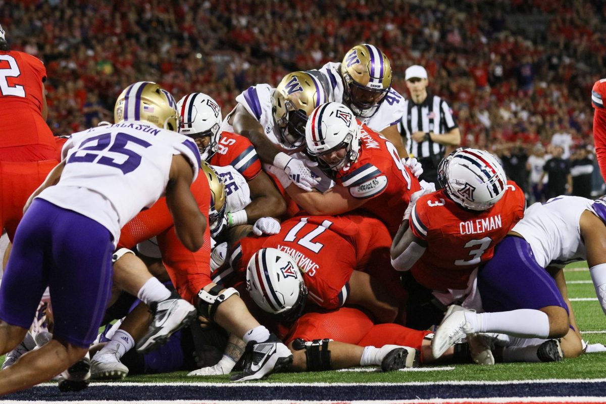 Arizona dog piles at the one yard line in an attempt to rush a touchdown in a close loss against Washington on Sept. 30 in Tucson. The Wildcats lost the game 24-31.