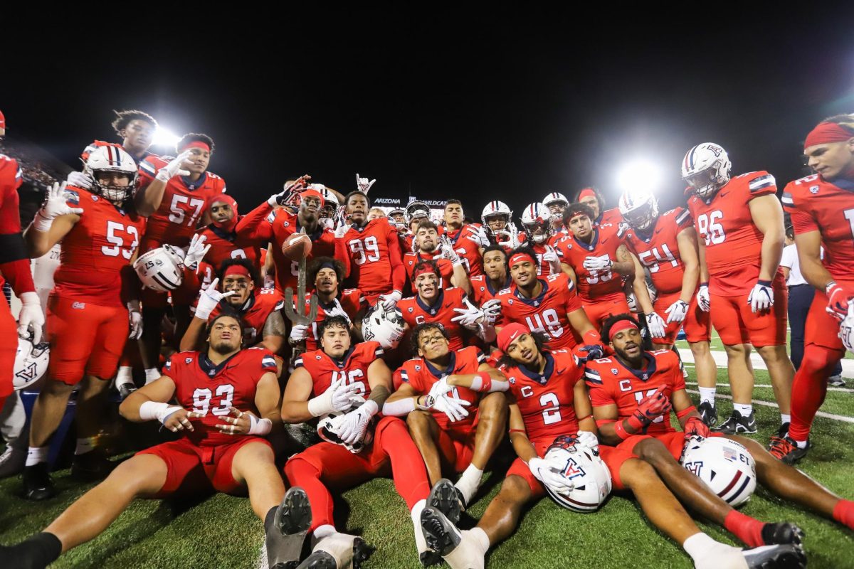 The defense for the Arizona football team poses after a forced fumble by safety Dalton Johnson late in the second half against the No. 7 University of Washington on Saturday, Sept. 30, in Tucson. The Wildcats lost the game 24-31.