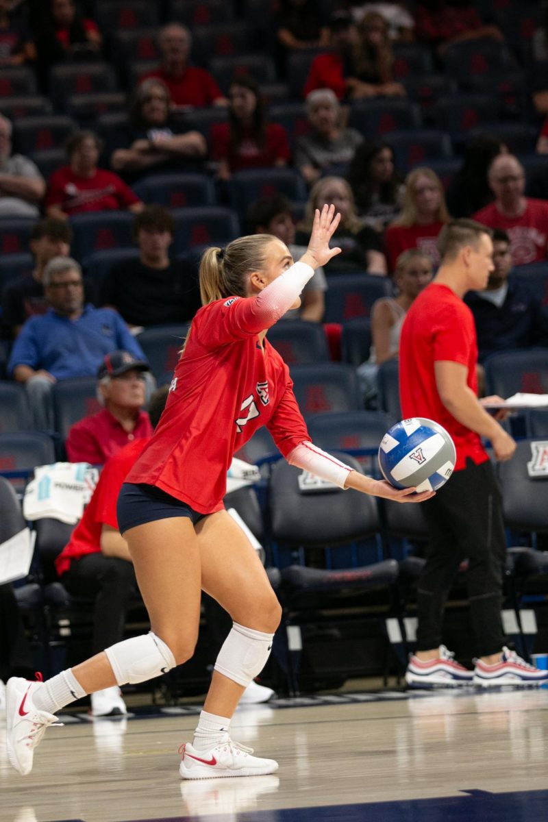 Joy Galles (12) of the Arizona Wildcats prepares to serve the ball at the home game against the UCLA Bruins on Friday, Oct. 6. Galles, a senior, has played as a defensive specialist for the Wildcats her entire college career. 