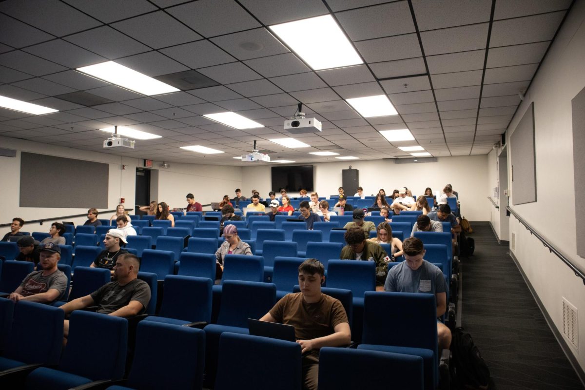 Students take notes during a lecture by Adam Donaldson in the Cesar E. Chavez Building on Oct 18. Donaldson’s class covers the history of warfare.