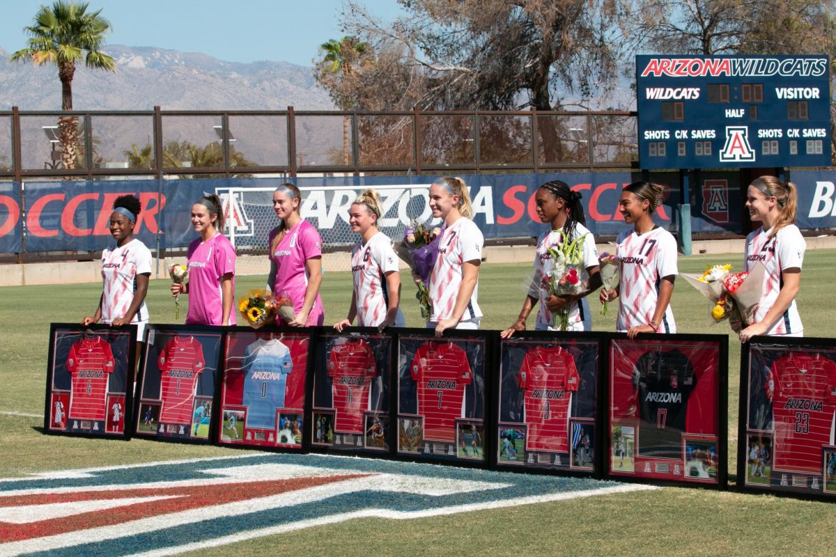 Seniors of the Arizona soccer team pose for photos as they are honored before their game against the USC Trojans at Murphey Field at Mulcahy Soccer Stadium in Tucson on Oct. 22. The seniors are all playing their final games with the Arizona Wildcats.