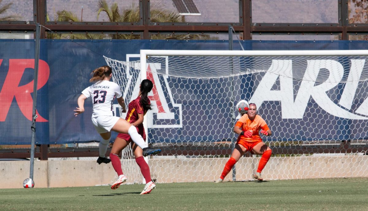 Arizona soccers Nicole Dallin (23) takes a shot against USC goalie Hannah Dickinson during their game at Murphey Field at Mulcahy Soccer Stadium in Tucson on Sunday, Oct. 22. Dallin’s shot was blocked, but Ella Hatteberg seized the opportunity to make a successful goal against the Trojans.