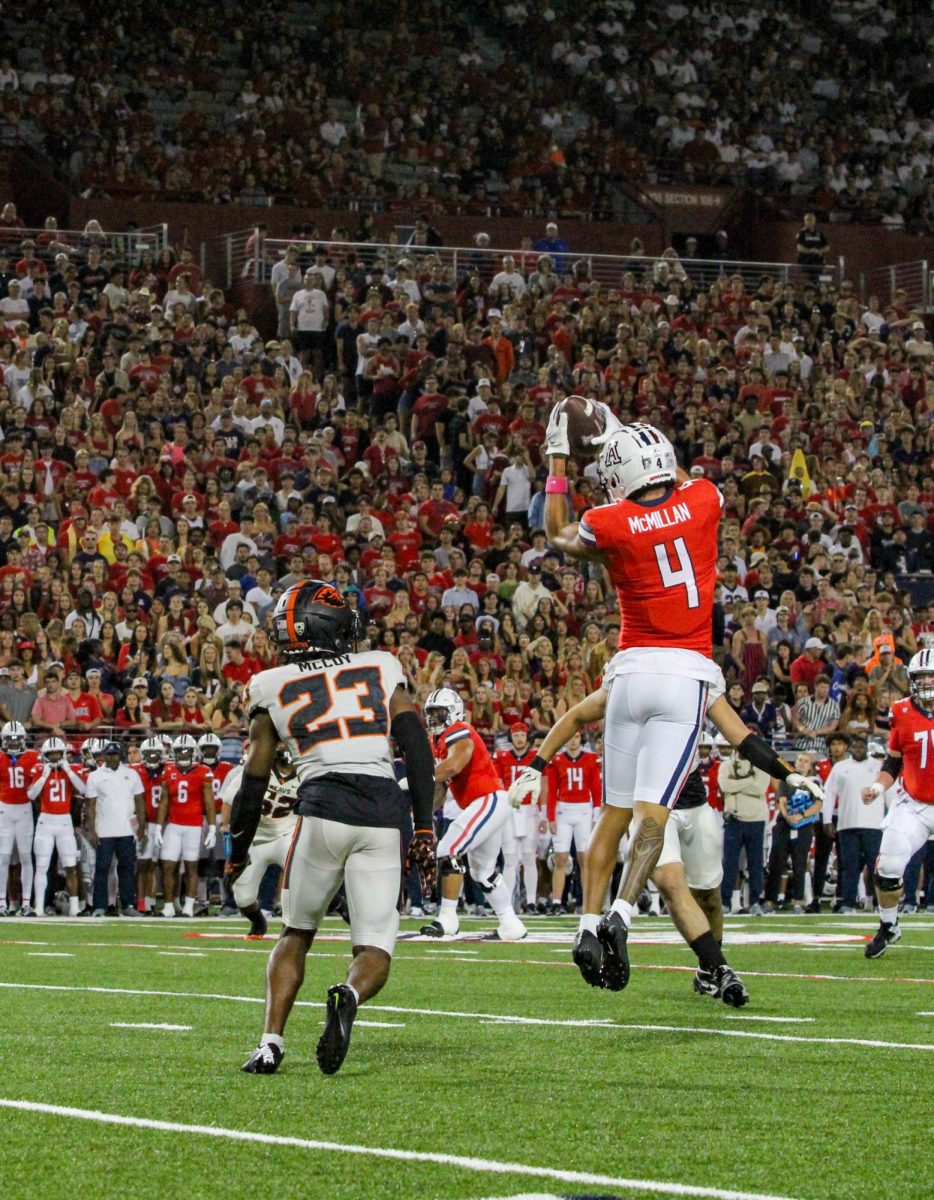 Arizona football wide receiver Tetairoa McMillan (4) secures a 20 yard pass during the football game against Oregon State University on Saturday, Oct. 28. Arizona won the game 27-24