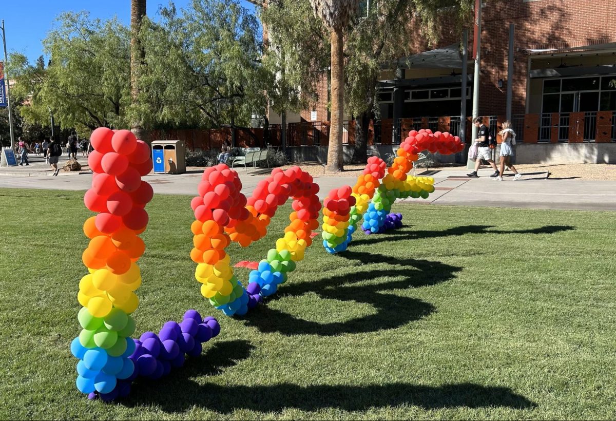 Rainbow+balloons+spelling+out+%E2%80%9CLove%E2%80%9D+are+featured+on+the+UA+Mall+on+Wednesday%2C+Oct.+11.+The+balloons+were+a+photo-op+where+several+students+took+pictures+with+their+friends+and+partners.%0A