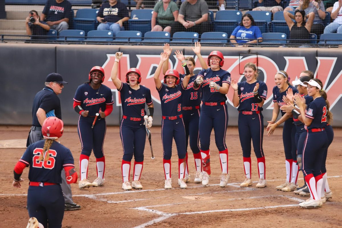 Sophomore+Olivia+DiNardo+is+greeted+at+home+plate+by+her+team+after+hitting+her+first+homerun+of+the+night+against+Phoenix+College+at+Hillenbrand+Stadium+on+Oct.+13.+Arizona+managed+to+cut+the+game+short+via+mercy+rule+after+winning+17-0.
