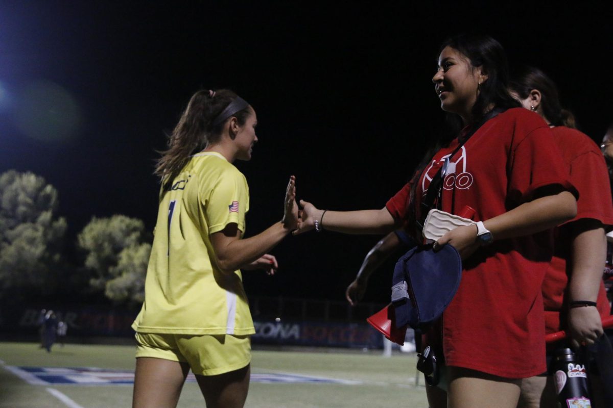 Goal keeper Hannah Mitchell (1) gives high fives after the game to ZonaZoo members. on Thursday, Oct. 19 on Murphey Field at Mulcahy Staudim. The ending score against UCLA was 1-4, with a loss for Arizona.