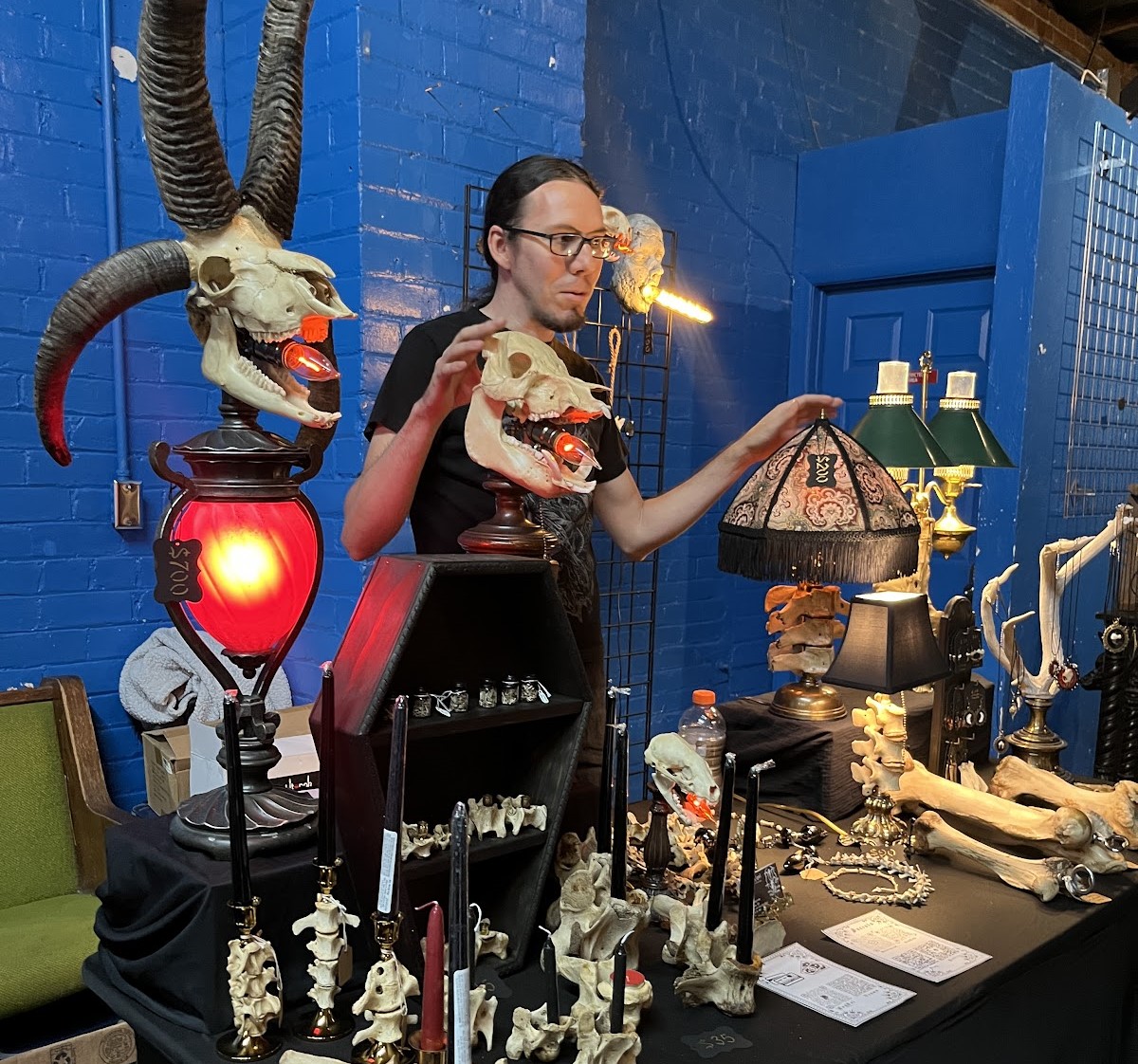 AJ ov Algol owner, AJ Kingström, sells handmade lamps, jewelry and wall decor made of bones he found in the desert at the 2023 Tucson Terrorfest convention, held at 191 E. Toole Ave.