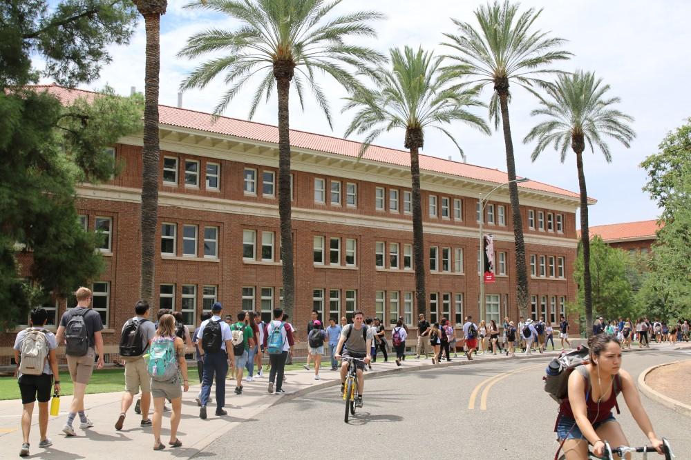 University of Arizona students walk throughout the center of campus. 