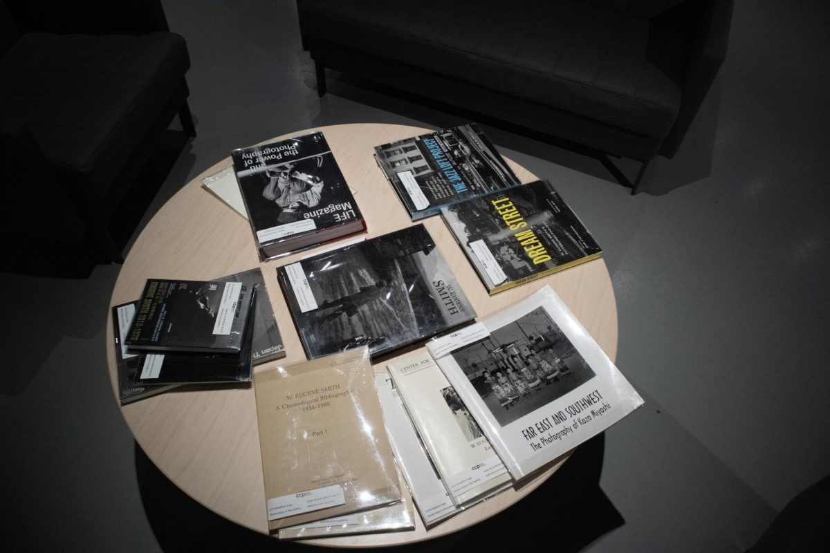A table displays books about Eugene Smith in the new CCP exhibit in Tucson on Nov. 14. The books also covered photographers adjacent to Smith such as Kozo Miyoshi.
