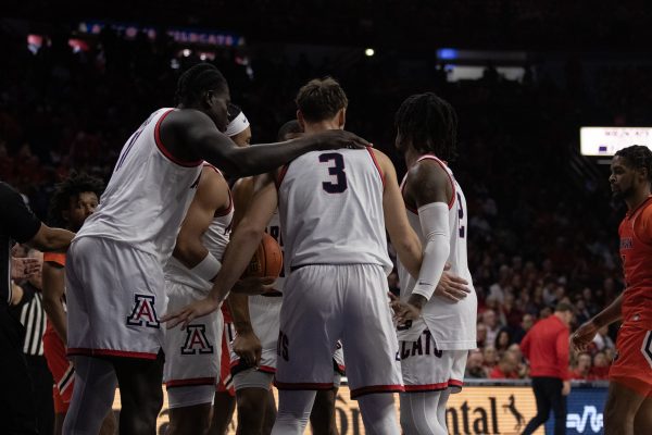 The Arizona mens basketball team huddles up during the game against Morgan State on Nov. 7 in McKale Center. The Wildcats won the game with a score of 122-59.