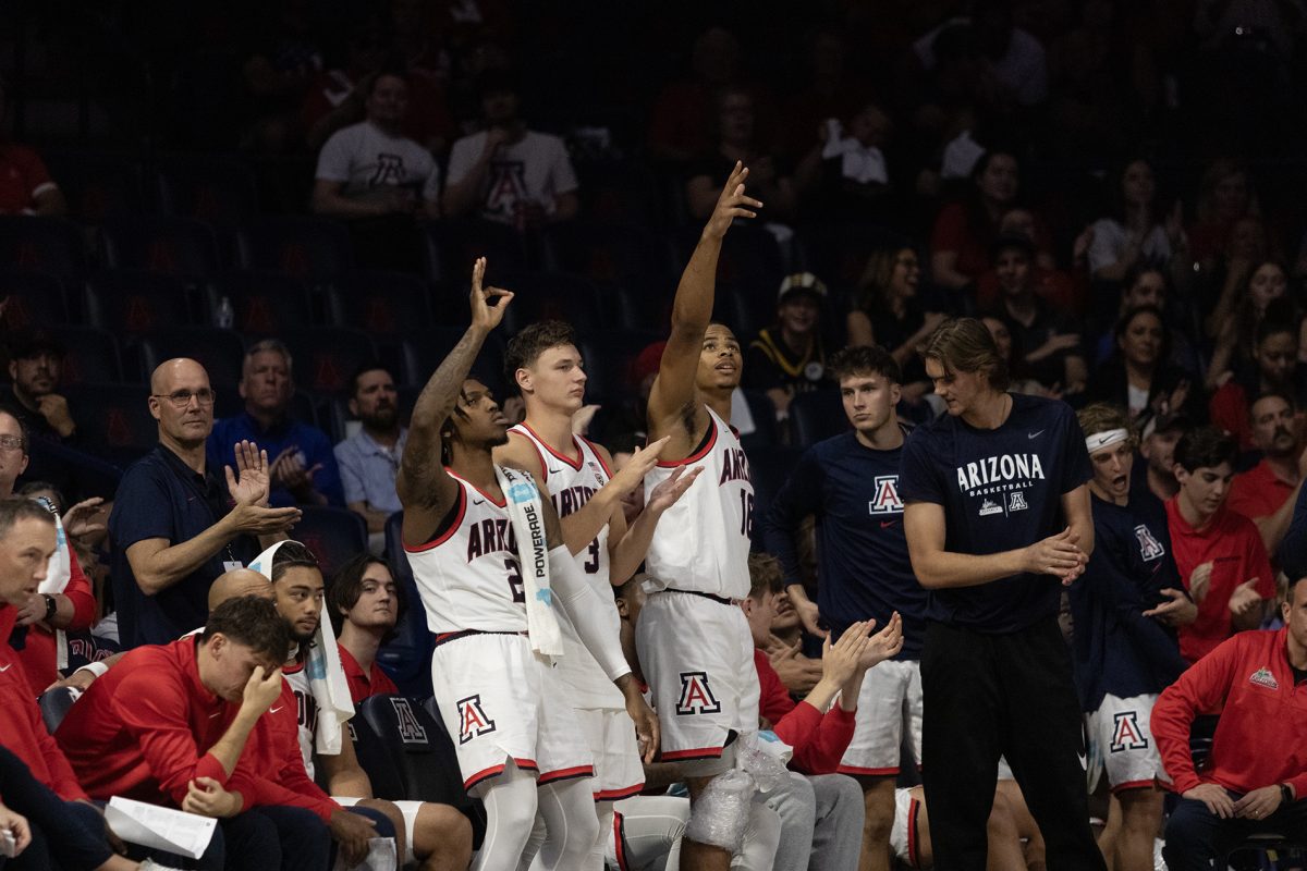The Arizona mens basketball team celebrates a teammate scoring a 3-pointer against Morgan State University on Tuesday, Nov. 7, in McKale Center. The Wildcats won the game 122-59.