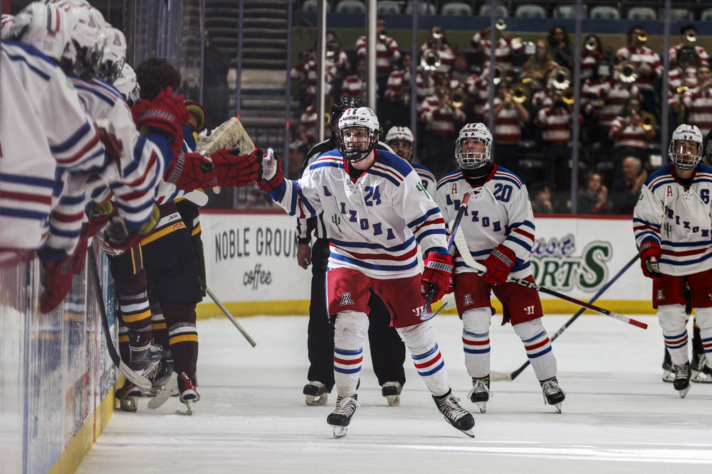 Freshman Trystan Swiger celebrates after Arizona scores in the third period against ASU on Friday, Dec. 8, in the Tucson Convention Center. Wildcats took the win 6-2.
