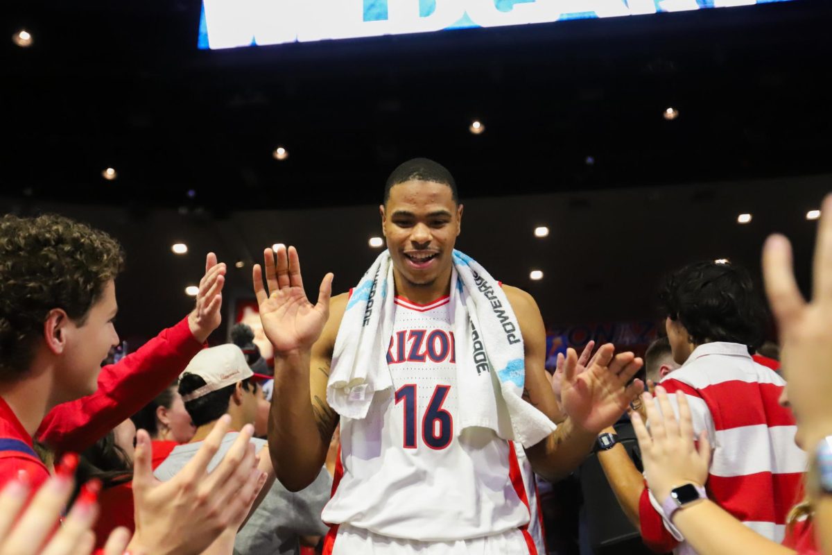 Keshad+Johnson+makes+his+way+through+the+Zona+Zoo+after+No.+1++Arizona+mens+basketballs+win+against+the+No.+23+University+of+Wisconsin+in+McKale+Center+on+Saturday%2C+Dec.+9.+