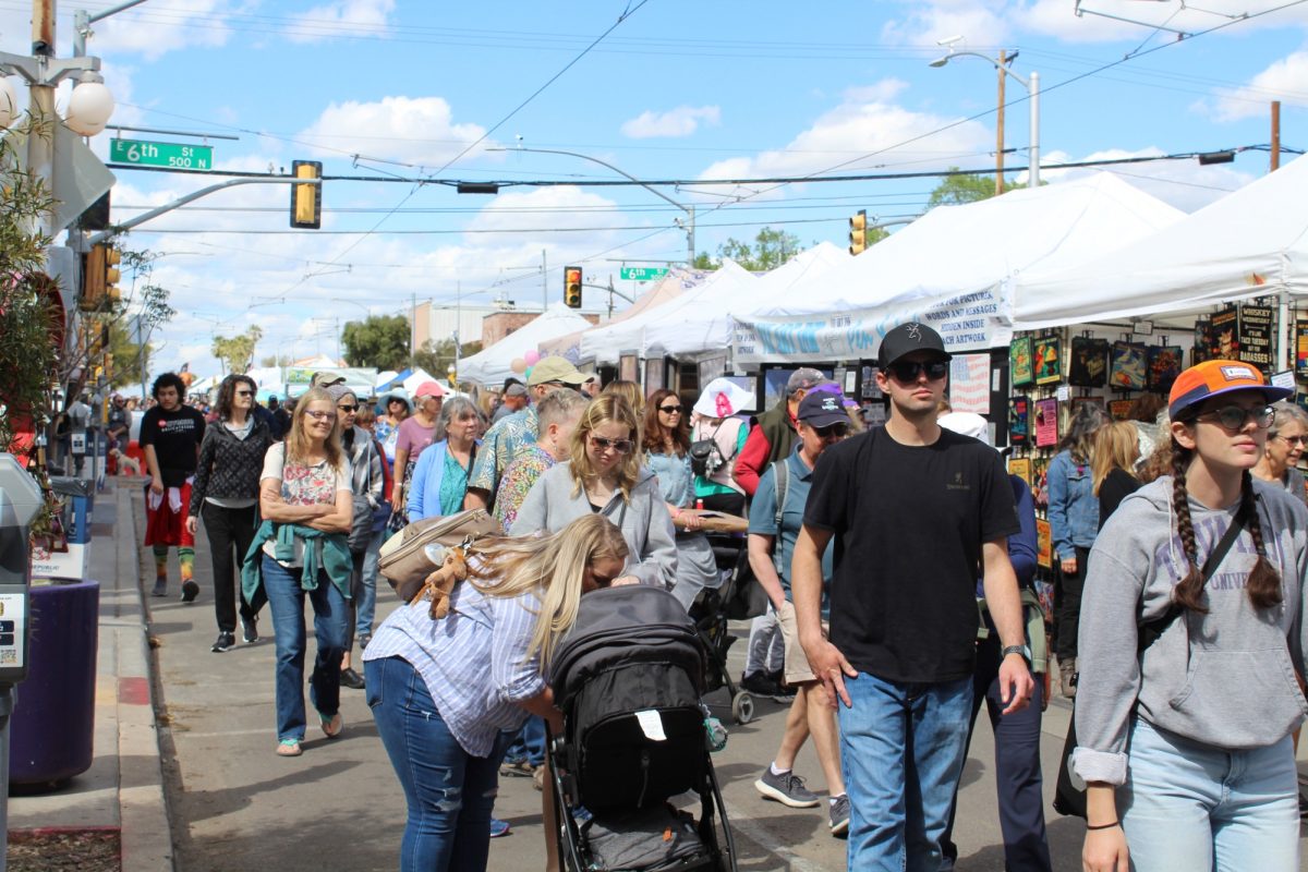 The+crowd+at+the+annual+Fourth+Avenue+Spring+Street+Fair+navigates+through+a+sea+of+stands+on+March+24%2C+2023.+People+of+the+Tucson+community+enjoyed+the+event+which+ran+Friday-Sunday.