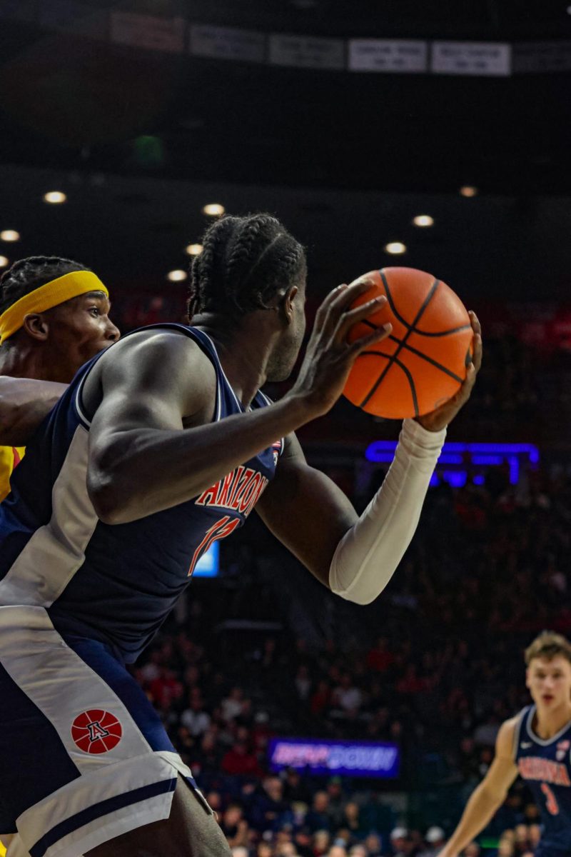 Arizonas Oumar Ballo (11) snags a rebound in UAs game against USC on Wednesday, Jan. 17. The Wildcats 82-67 point win secured their season  record of 13-4. 