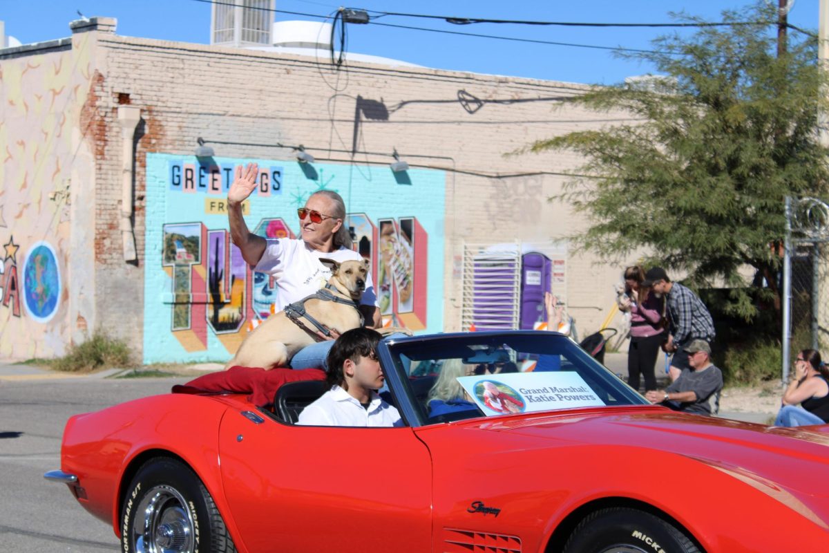 Katie Powers, the Grand Marshall of the parade, and her dog Charlie participate in the Pets of Pima & Friends of PACC Parade on Feb. 18. Over Powers 20 years she has helped to spay and neuter over 35,000 animals of low-income families in Southern Arizona. 