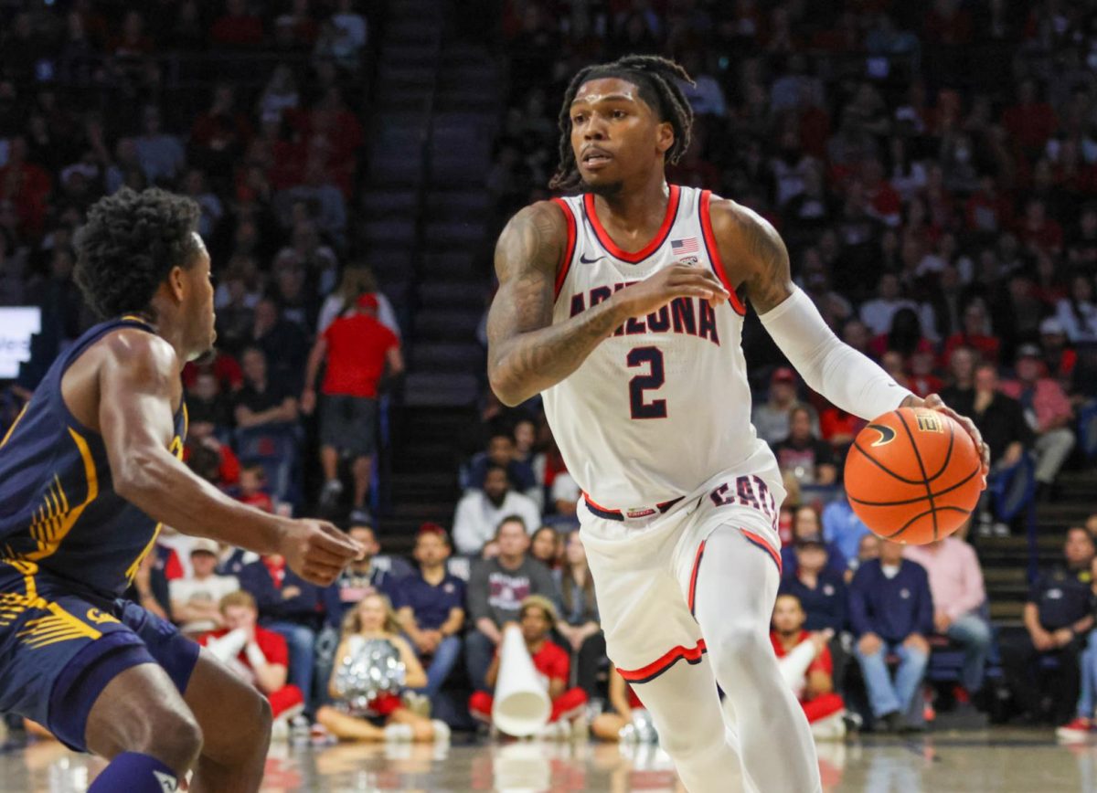 Arizona's Caleb Love drives down the court in the Wildcats’ game against Cal on Feb. 1 in McKale Center. Love scored 12 points in the game, including a 3-pointer in the second half.