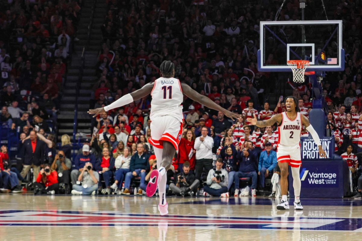 UAs Oumar Ballo (11) celebrates after hitting his thousandth career point in the Wildcats game against Utah University on Jan. 6. The game ended in a 92-73 point win for UA.