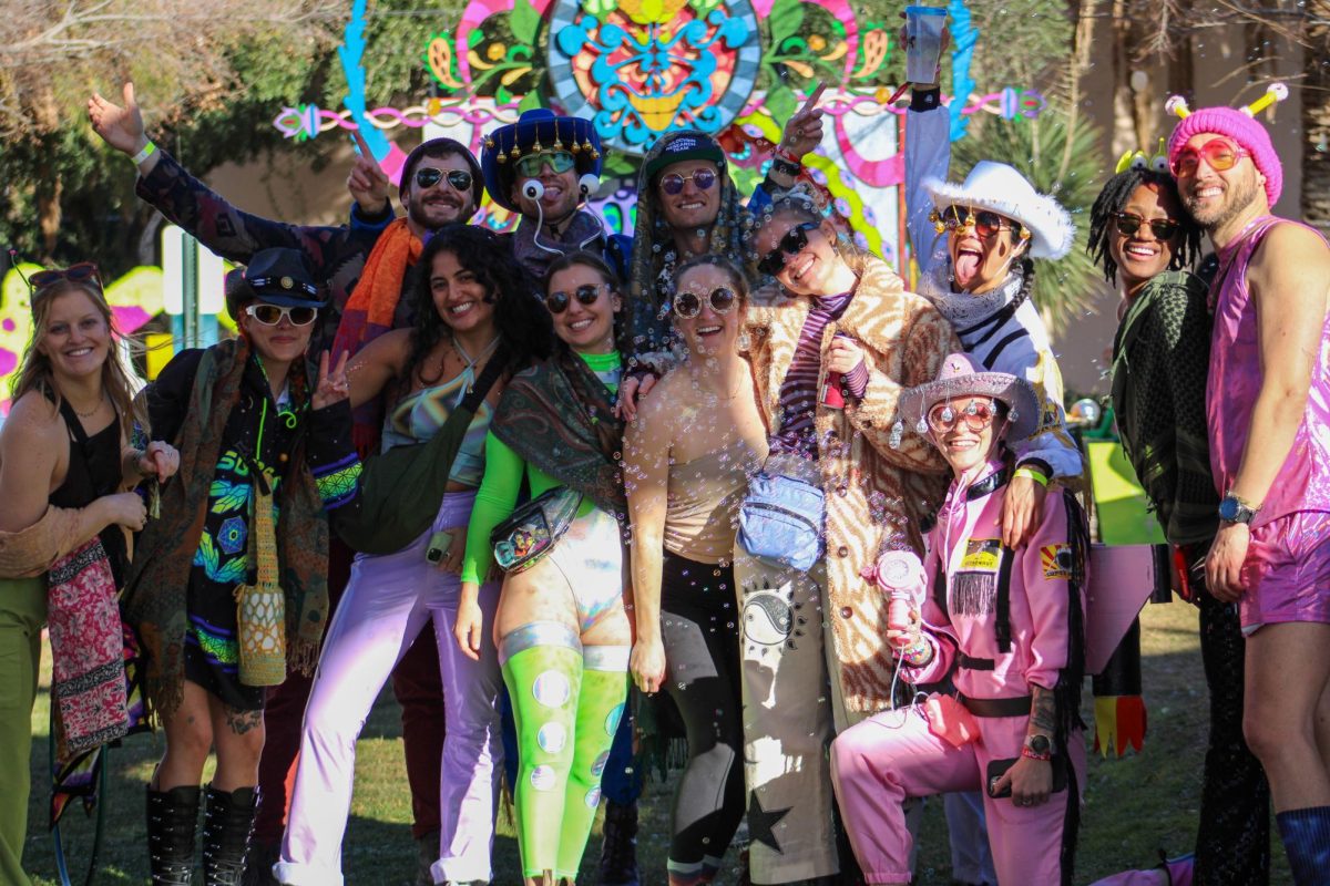Friends pose for a group photo on Feb. 3 at the Gem & Jam Festival on the Pima County Fairgrounds. Attendees wore creative and unique costumes.