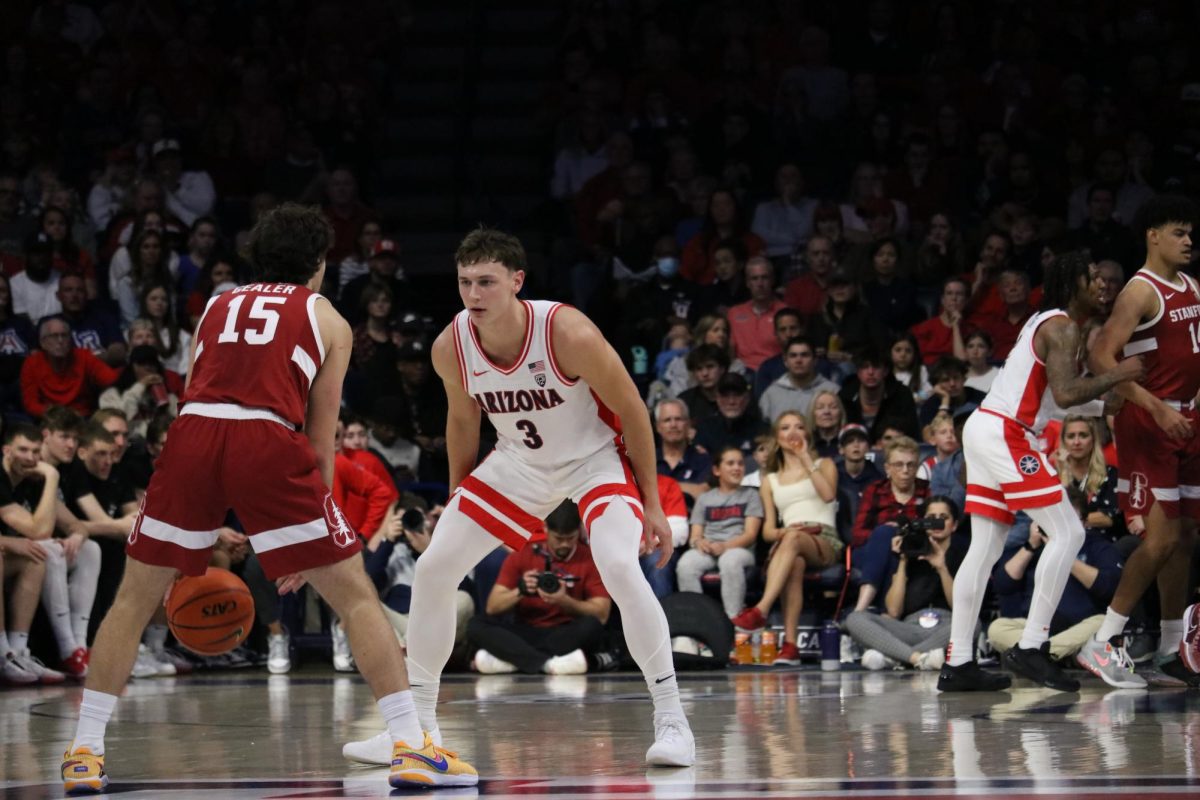 Pelle Larsson pulls a tight defense on Stanford in McKale Center on Feb. 4. The Wildcats scored 34 points in the first period and ended the second period with 82 total points for the win against the Cardinals.