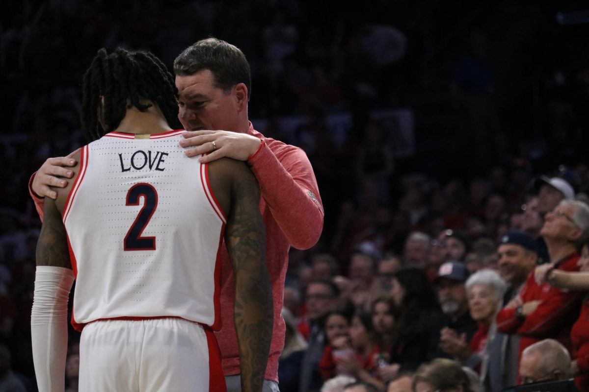 Mens basketball head coach Tommy Lloyd shares a moment with Caleb Love after he scored for Arizona against Stanford on Feb. 4 in McKale Center. The team is now 17-5 to the season. 