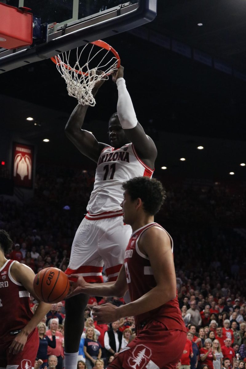 Oumar Ballo performs a dunk against Stanford in McKale Center on Feb. 4. Ballo contributed 18 points to the 82-71 win for the Wildcats.