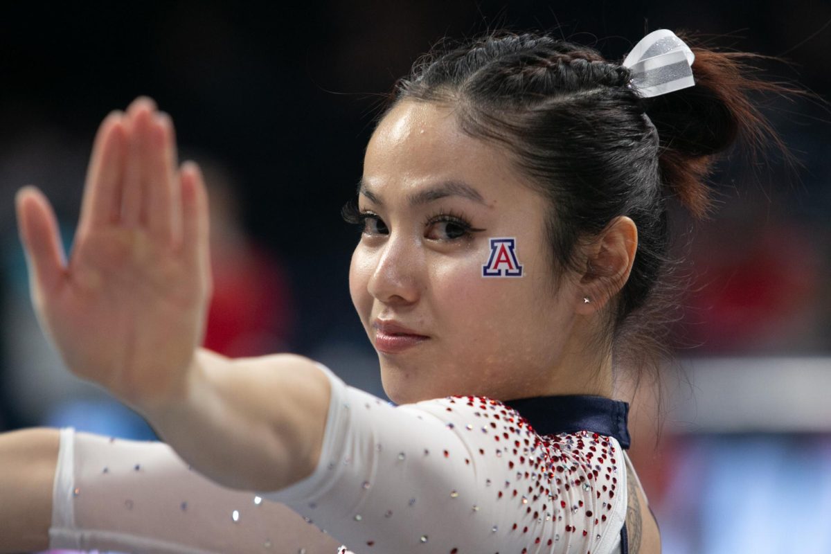 Malia Hargrove begins her floor routine during the Wildcats’ meet against Arizona State on Feb. 15 in McKale Center. Hargrove finished off the Wildcats’ floor performances with a score of 9.875.
