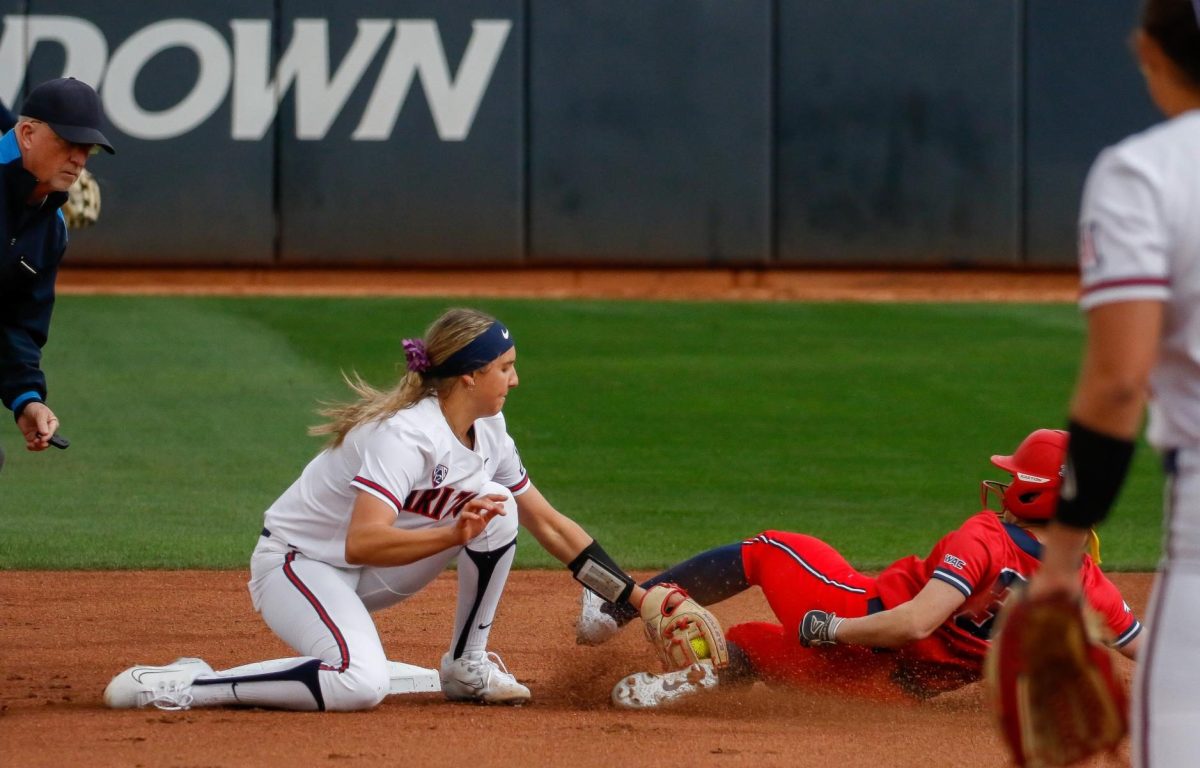 Arizona softballs No. 22 Tayler Biehl tags  out a University of Utah Tech player as they try to steal second on Thursday Feb. 8, at Mike Candrea field at Rita Hillenbrand stadium. Arizona went on to sweep the Candrea Classic winning all 5 of their games by mercy rules. 