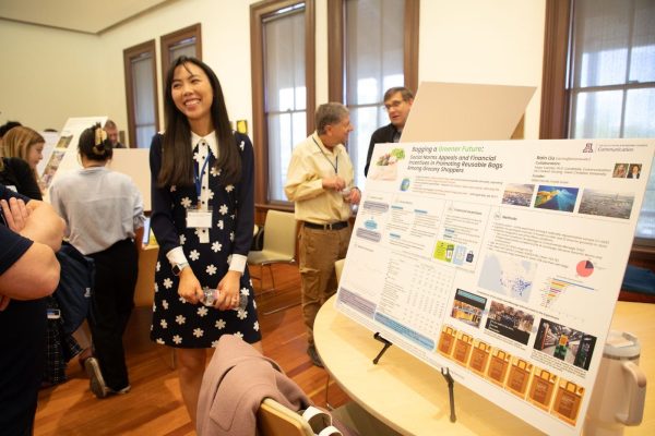 UA Assistant professor of communication Rain Liu’s stand in front of her poster titled: “Bagging a Greener Future: Social Norms Appeals and Financial Incentives in Promoting Reusable Bags Among Grocery Shoppers,” at the SBSRI showcase on Feb.1. Liu looked at how communicative social norms can affect the use of plastic grocery bags by shoppers. (Courtesy Mackenzie Meitner)