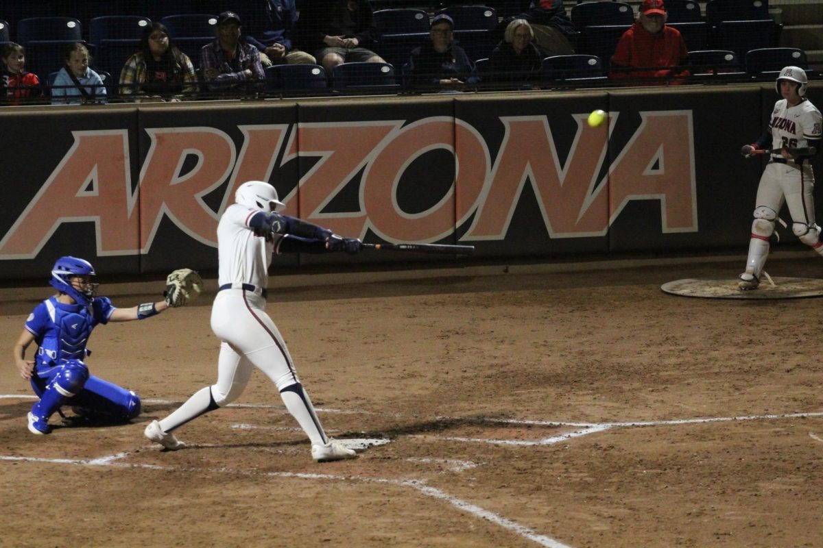 Arizonas Carlie Scupin hits a home-run during the fifth inning at the Hillenbrand Invitational against Drake on Feb. 22. Scupins home-run brought in two basemen and herself, putting Arizona up 3-0.