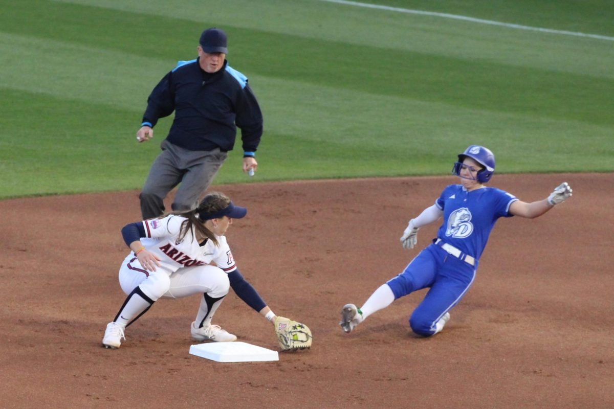 Arizonas Allie Skaggs gets the ball to get Drakes Carey Koenig out at second base at the Hillenbrand Invitational on Feb. 22. Skaggs had three put outs during the game.