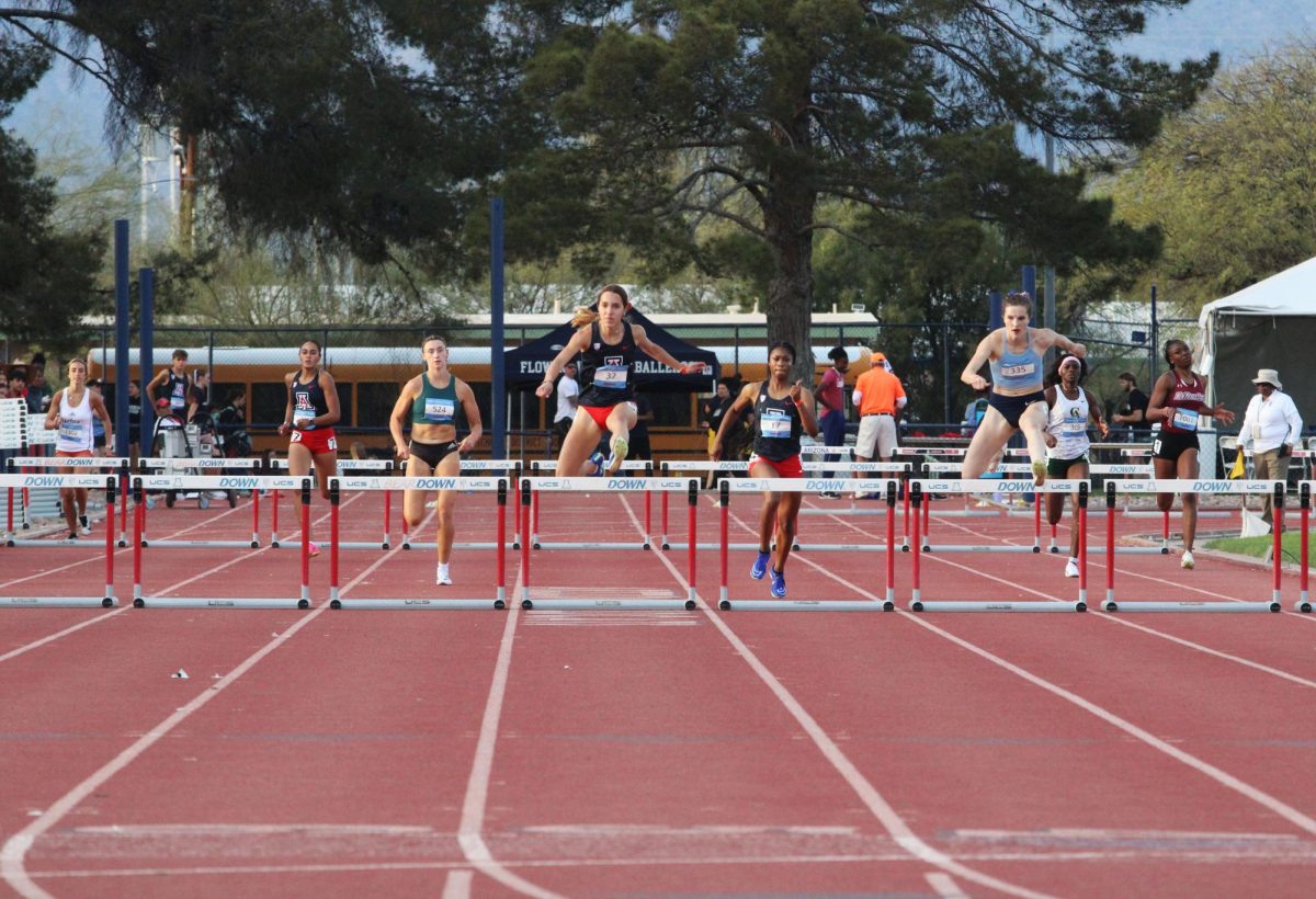 University of Arizonas womens track and field runners participate in the womens 400 hurdles at Roy P. Drachman Stadium on March 22. Leading in the middle is Antonia S. Nunez, and also running for UA is Athena Montgomery (left) and Keilee Hall (right).

