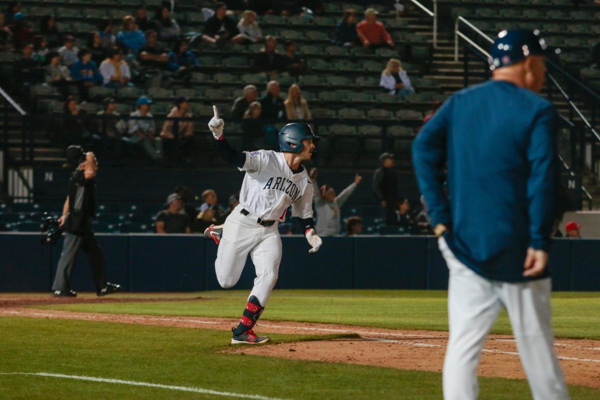 Garen Caulfield rounds the bases in the 8th inning after hitting a home run against UCLA at Hi-Corbett Field on March 28. Caulfield was named player of the game by coach Chip Hale.