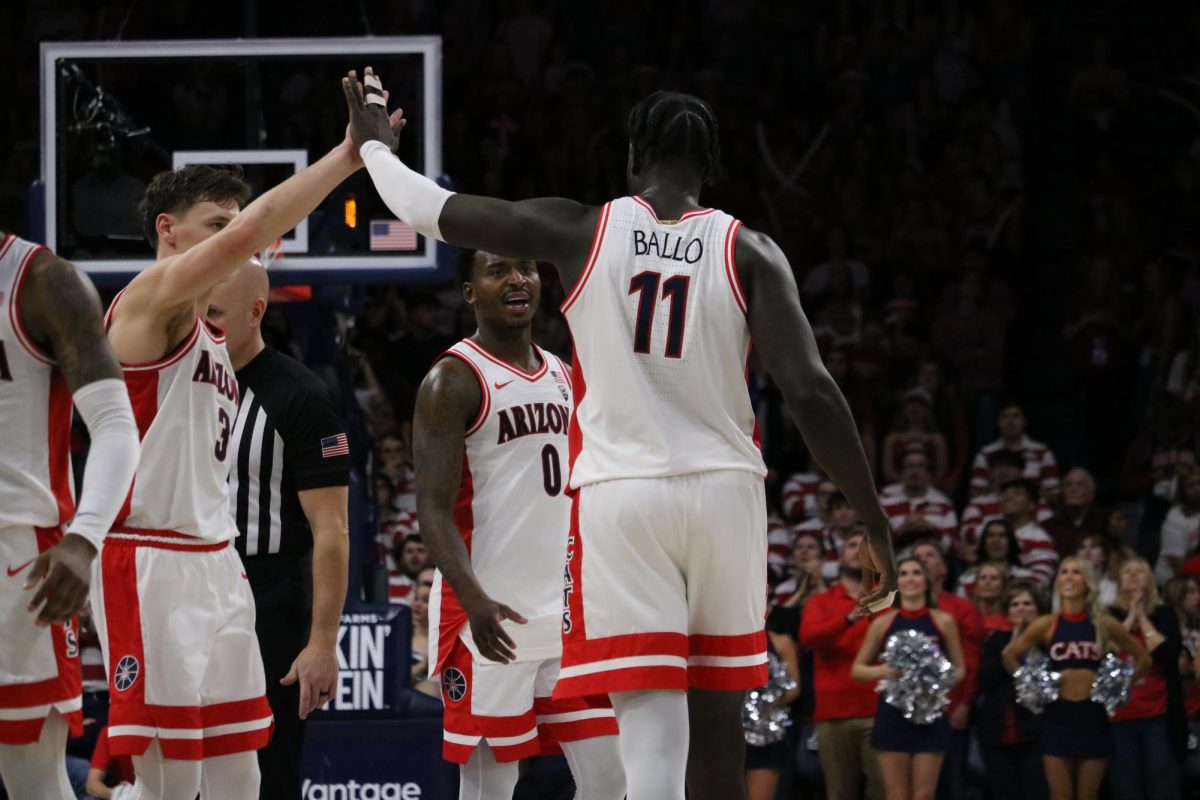 Oumar+Ballo+high+fives+his+teammates+during+a+game+against+Stanford+in+McKale+Center+on+Feb.+4.+Ballo+contributed+18+points+to+the+total+of+82.