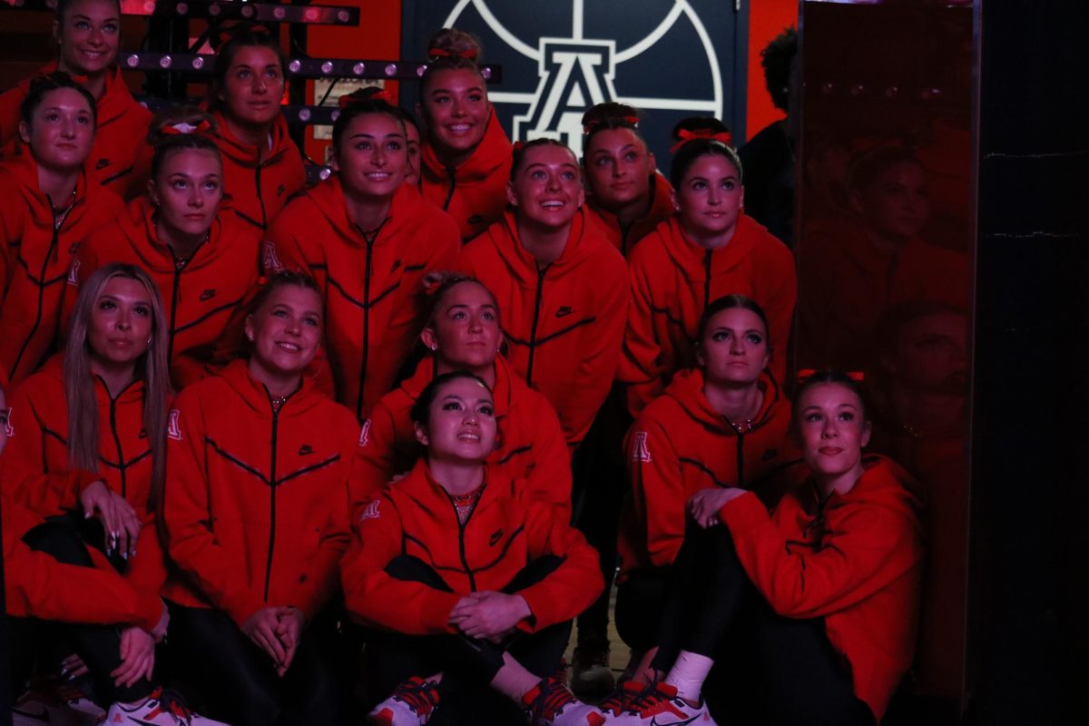 The+Arizona+gymnastics+team+watches+their+introduction+video+before+a+meet+in+McKale+Center+on+March+13.+The+Gymcats+won+against+Southern+Connecticut+State+with+an+overall+score+of+196.9.