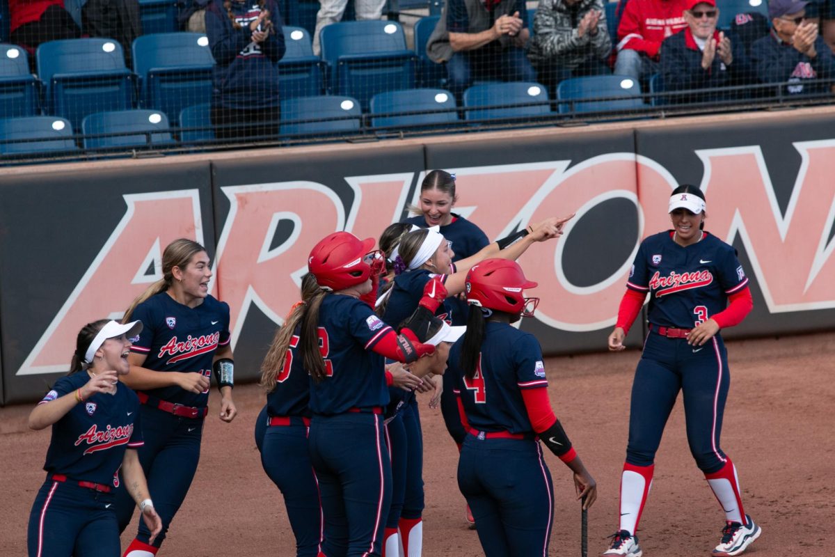 Players cheer on Blaise Biringer as she makes it back to home plate after a home run during Arizona’s game against Washington on March 16 at Rita Hillenbrand Stadium. The three runs scored during this play would be the Wildcats’ only points during the game.
