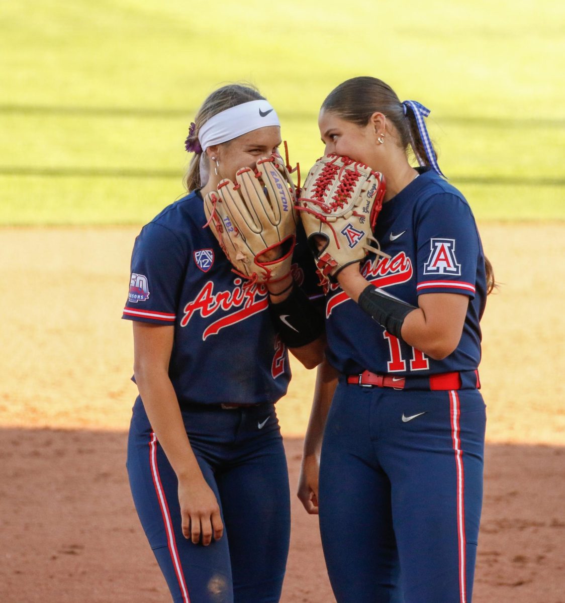 After+walking+a+batter+short+stop+Tayler+Biehl+talks+to+pitcher+Miranda+Stroddard+at+Rita+Hillenbrand+Stadium+on+March+16.+The+Wildcats+lost+the+game+against+No.+8+University+of+Washington+11-3.+