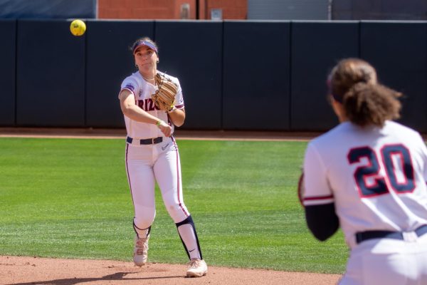 Arizona softball second baseman Allie Skaggs makes a throw to first base to get an out on March 17 at Rita Hillenbrand Stadium. The Wildcats beat No. 8 ranked University of Washington 2-0. 