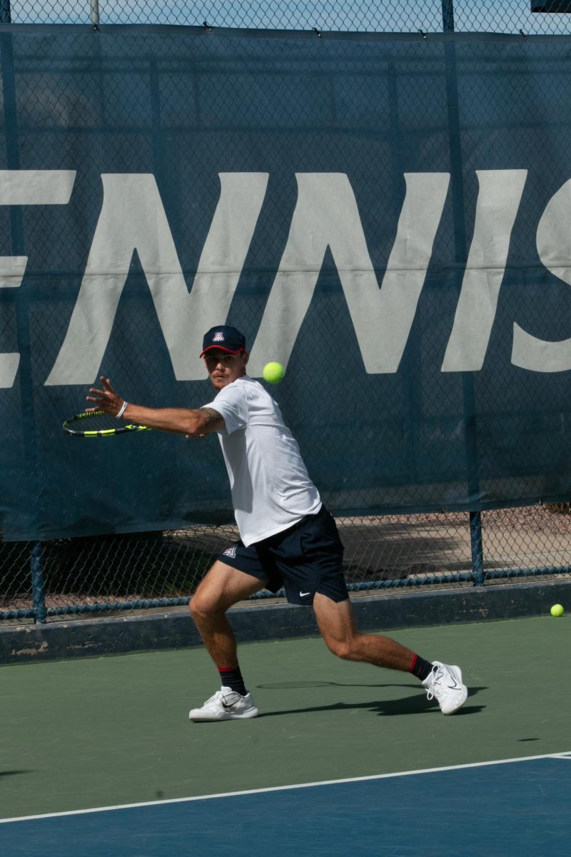 Colton Smith returns the ball in a singles match against ASU on April 7 at Robson Tennis Center. Smith would ultimately fall to ASU in a straight set loss in his singles match.