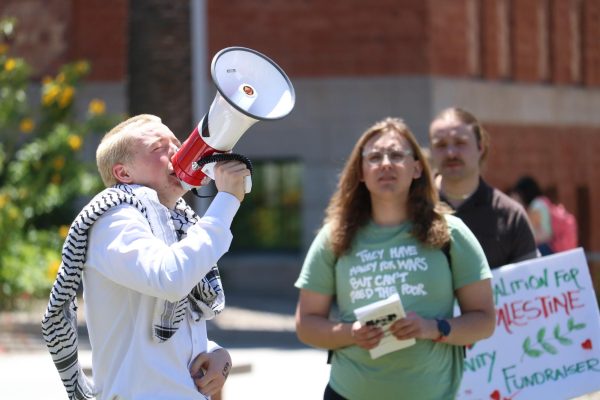 Harlow Parkin leads a chant on the mall on April 29. The protesters called for an end to U.S. and local aid to Israel.