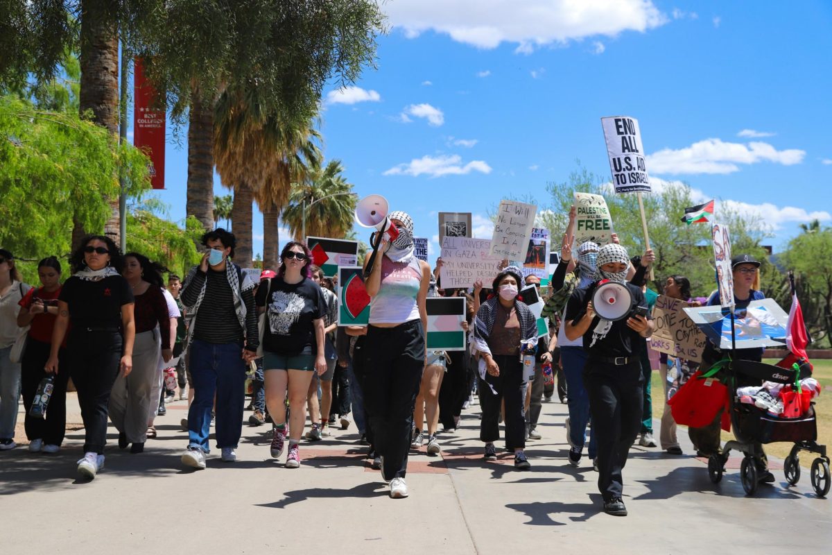 Protesters+start+marching+along+the+UA+Mall+at+the+University+of+Arizona+on+April+25.+The+protest+supporting+Palestine+lasted+for+an+hour+with+marching+around+the+Student+Union+Memorial+Center+and+Old+Main.%0A