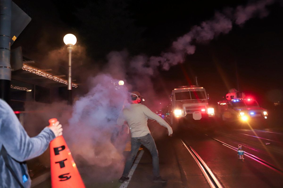 Tear gas, deployed by law enforcement officials, surrounds protestors gathered along Park Avenue after having fled their encampment on the morning of May 10. SWAT vans were also present north of University Boulevard and Park Avenue. 