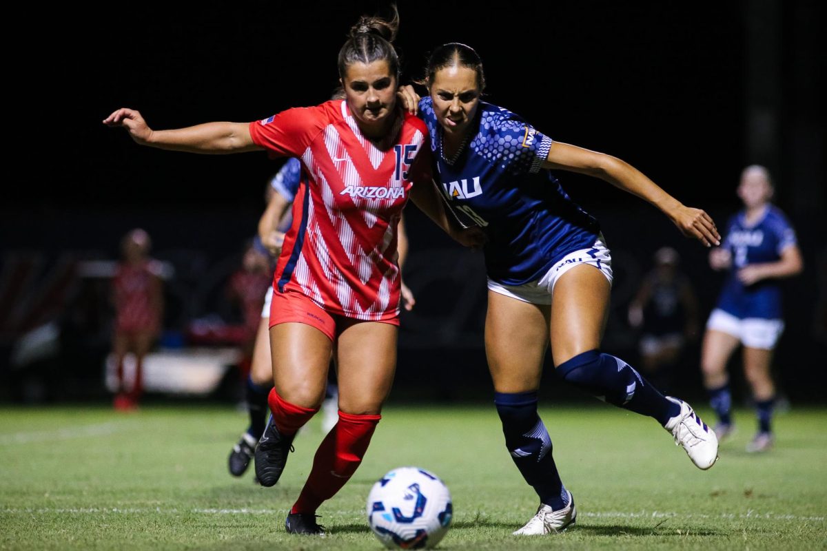 Ella Hatteberg races an NAU defender for the ball late in the second half on Aug. 22 at Murphy Field.