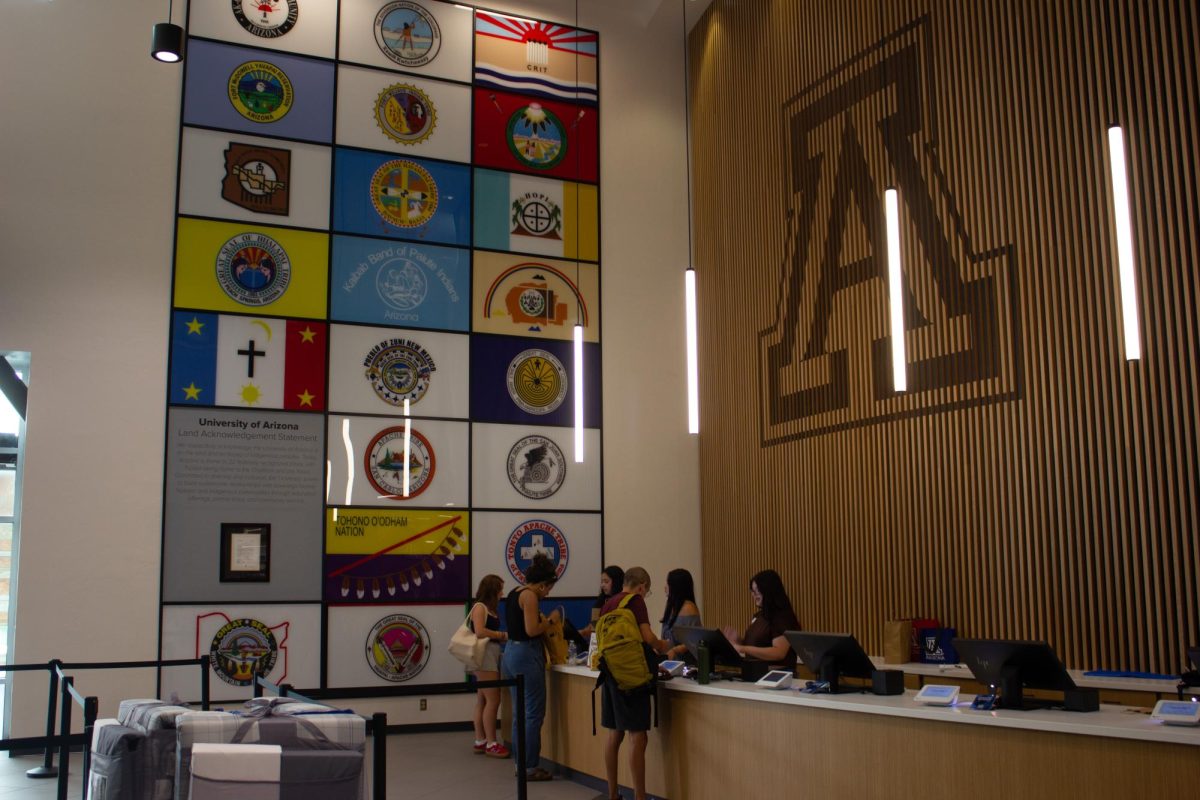 Students check out at the Campus Store registers on Aug. 28. The new checkout area includes an A-insignia and tribal flag wall, celebrating Native American culture in Arizona.