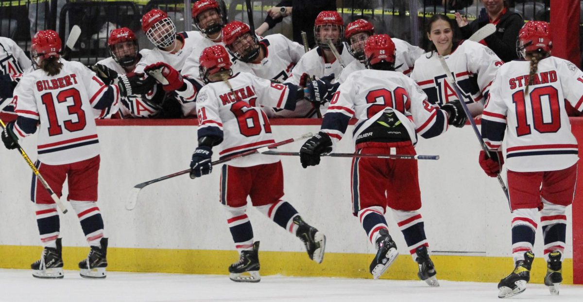 University of Arizona players Elly Gilbery, 13, Grace McKeag, 61, Teila Saarinen, 26 and Hannah Strand, 10, celebrate their first point with teammates during the third period in the Tucson Convention Center on Sept. 26. UA women's hockey made its debut during this game.