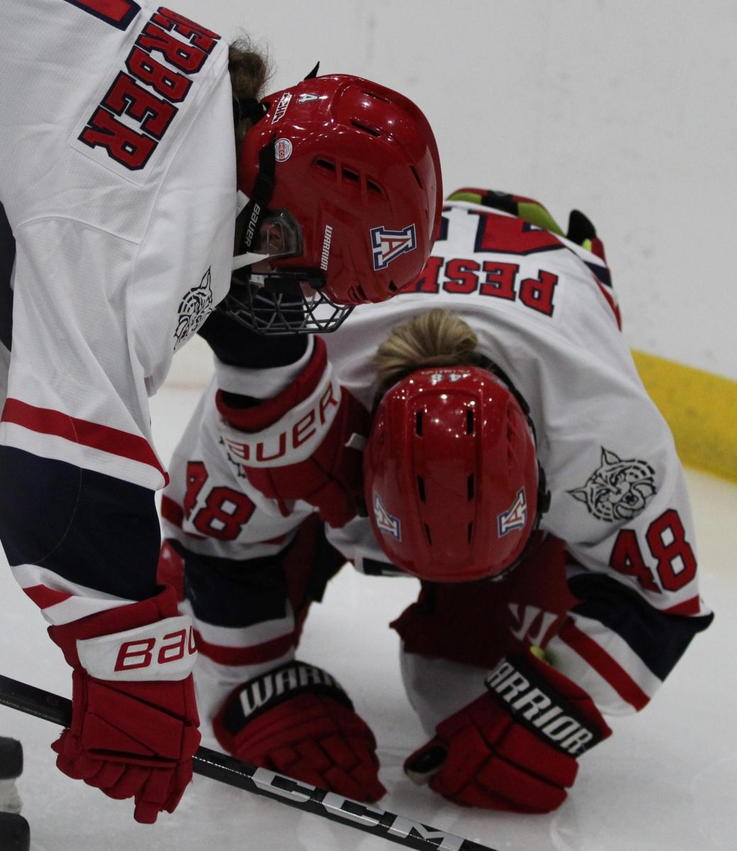 UA defense Lucy Verderber (4) checks on UA defense Rylan Peska (48) after a hit during the third period at in Tucson Convention Center on Sept. 26. Verderber is a freshman from Walpole, Mass.