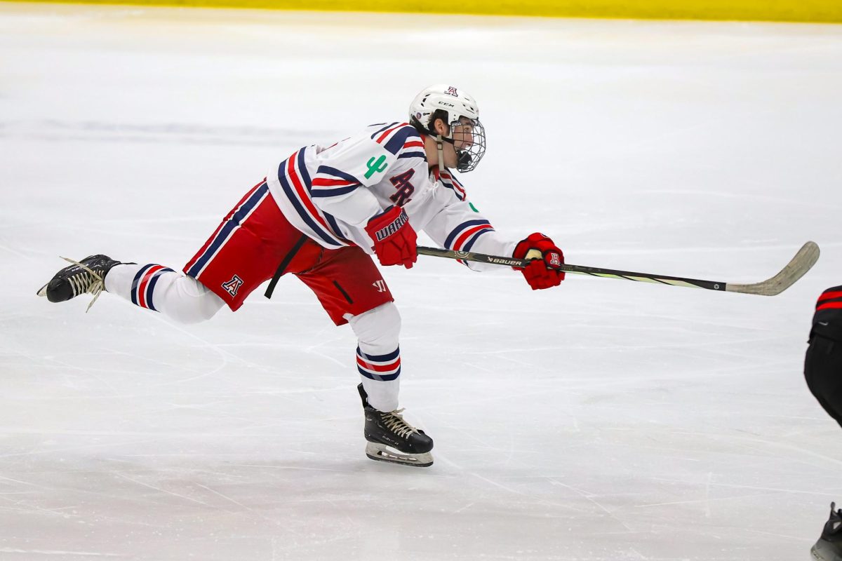 Forward Carter Hanrahan takes a shot against San Diego State University in Tucson Convention Center on Sept. 26. This is Hanrahan's first season of college hockey.